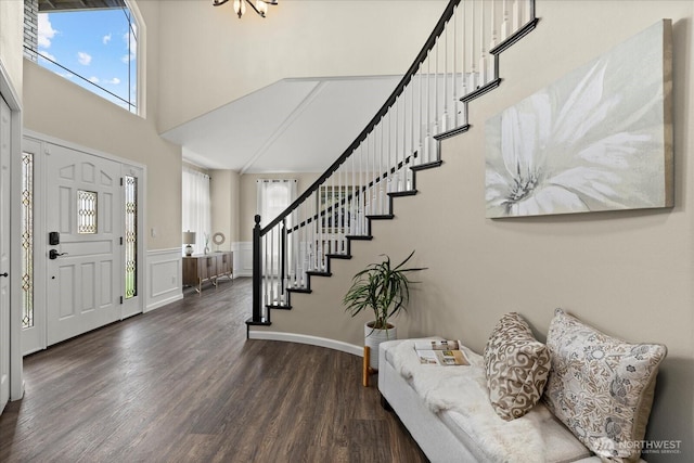 4212 145th Pl SE, Snohomish, WA 98296 - foyer entrance with a towering ceiling, stairs, dark wood-type flooring, plenty of natural light, and a wainscoted wall