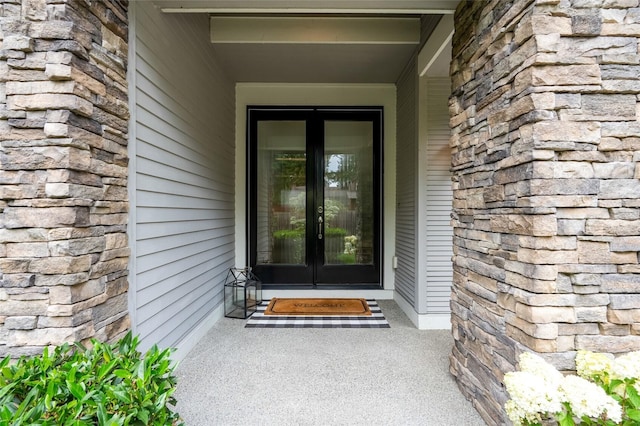 619 Graham Ave NE, Renton, WA 98059 - doorway to property featuring french doors and stone siding