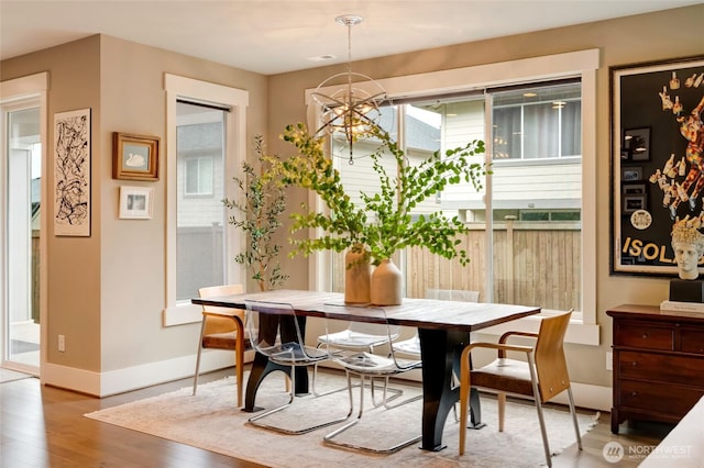 619 Graham Ave NE, Renton, WA 98059 - dining area with wood finished floors and a chandelier