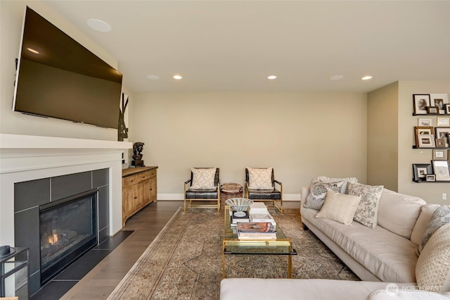 619 Graham Ave NE, Renton, WA 98059 - living room featuring dark wood finished floors, a tiled fireplace, and recessed lighting