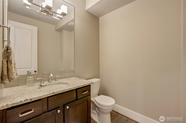 619 Graham Ave NE, Renton, WA 98059 - half bath featuring vanity and wood finished floors