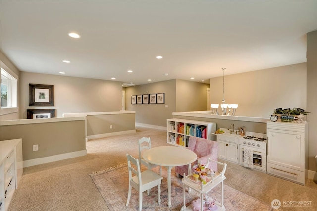 619 Graham Ave NE, Renton, WA 98059 - playroom featuring light colored carpet, recessed lighting, and a chandelier