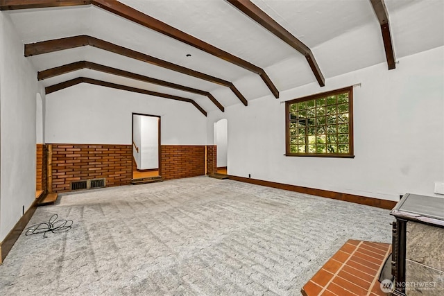 5510 Mt Baker Hwy, Deming, WA 98244 - unfurnished living room with a wainscoted wall, carpet flooring, and arched walkways