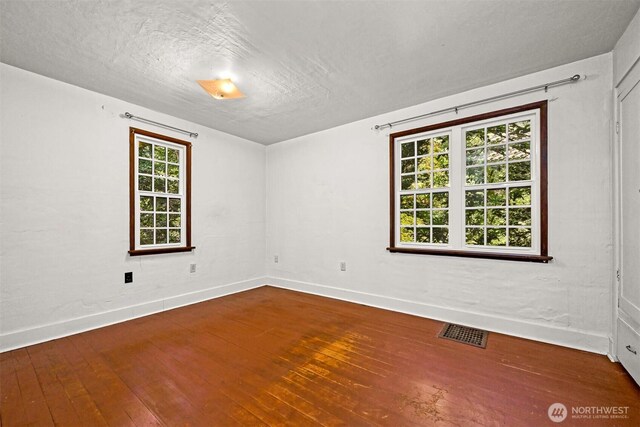 5510 Mt Baker Hwy, Deming, WA 98244 - empty room with hardwood / wood-style flooring and a textured ceiling