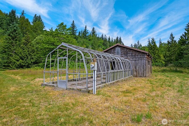 5510 Mt Baker Hwy, Deming, WA 98244 - view of grassy yard featuring a view of trees and an outbuilding