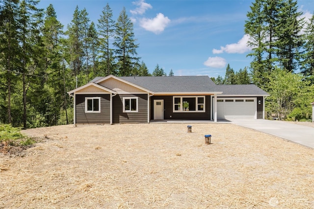 13540 Carney Lake Rd SW, Port Orchard, WA 98367 - view of front of house featuring concrete driveway, a garage, and a shingled roof