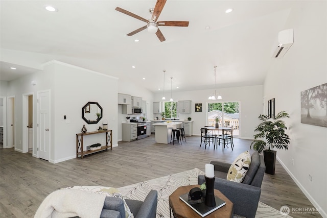 13540 Carney Lake Rd SW, Port Orchard, WA 98367 - living room featuring a wall mounted air conditioner, a ceiling fan, high vaulted ceiling, recessed lighting, and light wood-style flooring
