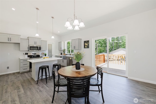 13540 Carney Lake Rd SW, Port Orchard, WA 98367 - dining space with a chandelier, light wood finished floors, recessed lighting, and high vaulted ceiling