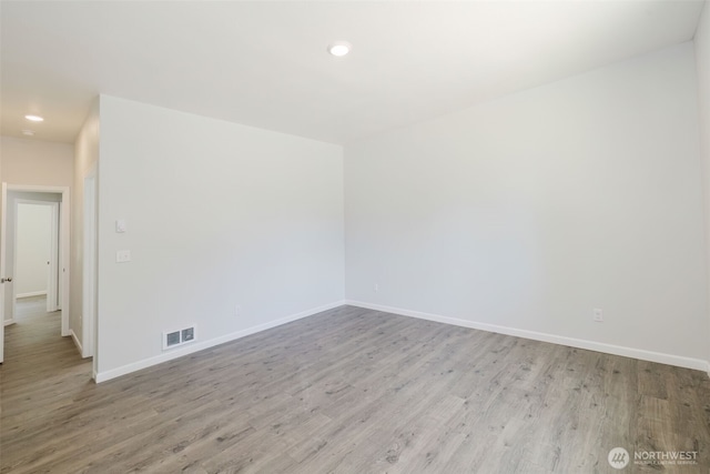 13540 Carney Lake Rd SW, Port Orchard, WA 98367 - spare room with wood finished floors and recessed lighting