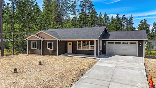 13540 Carney Lake Rd SW, Port Orchard, WA 98367 - view of front of house featuring an attached garage, concrete driveway, and a shingled roof