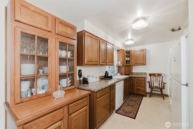 30026 5th Ave SW, Federal Way, WA 98023 - kitchen with white appliances, brown cabinets, and glass insert cabinets