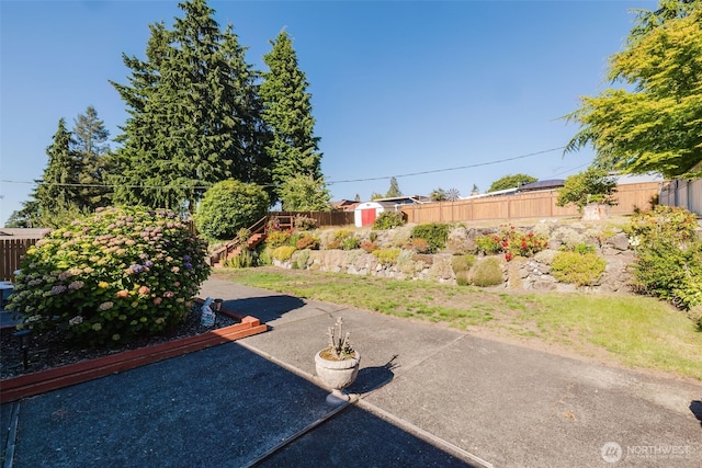 30026 5th Ave SW, Federal Way, WA 98023 - fenced backyard with a patio area and a storage unit