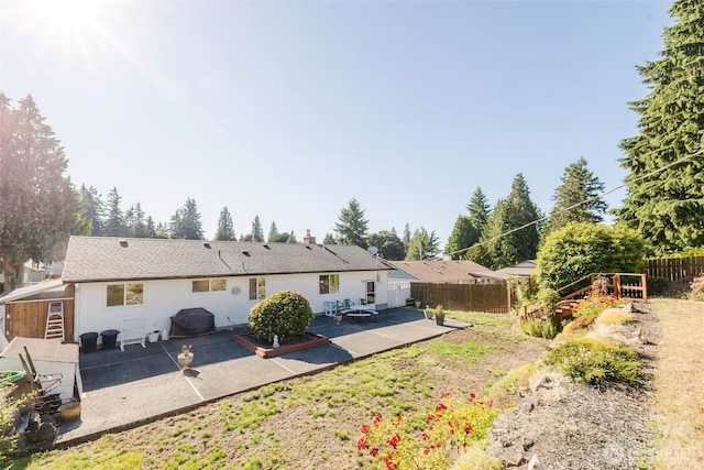 30026 5th Ave SW, Federal Way, WA 98023 - rear view of house with a patio and a fenced backyard