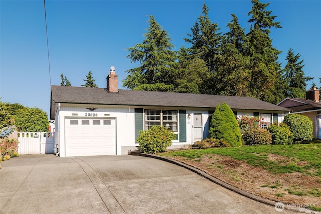 30026 5th Ave SW, Federal Way, WA 98023 - ranch-style home with a garage, concrete driveway, and a chimney