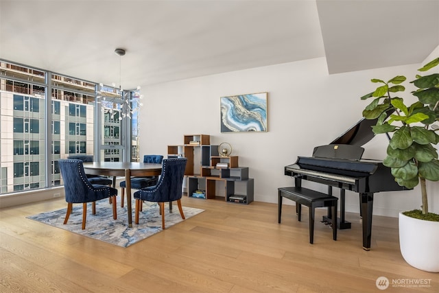 583 Battery St Unit 3802, Seattle, WA 98121 - dining area featuring wood finished floors and expansive windows