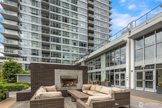 583 Battery St Unit 3802, Seattle, WA 98121 - view of patio featuring an outdoor living space with a fireplace and a deck