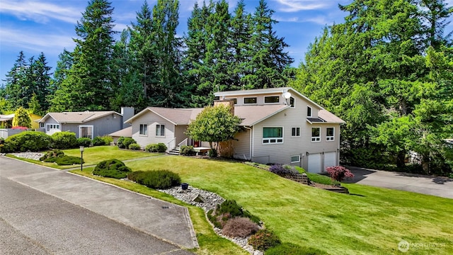 527 Fern Rd, Bellingham, WA 98225 - view of front facade featuring asphalt driveway, an attached garage, and a front lawn