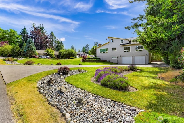 527 Fern Rd, Bellingham, WA 98225 - view of green lawn with an attached garage and concrete driveway