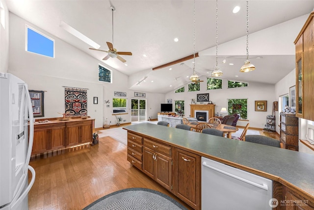 527 Fern Rd, Bellingham, WA 98225 - kitchen with white appliances, a fireplace, hardwood / wood-style floors, recessed lighting, and ceiling fan