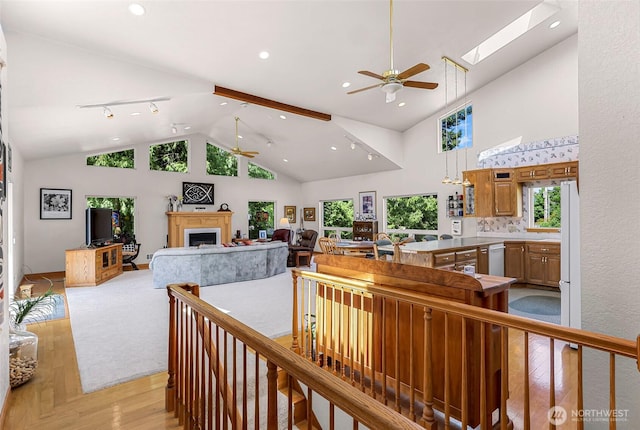 527 Fern Rd, Bellingham, WA 98225 - corridor with light wood-type flooring, high vaulted ceiling, recessed lighting, and a skylight