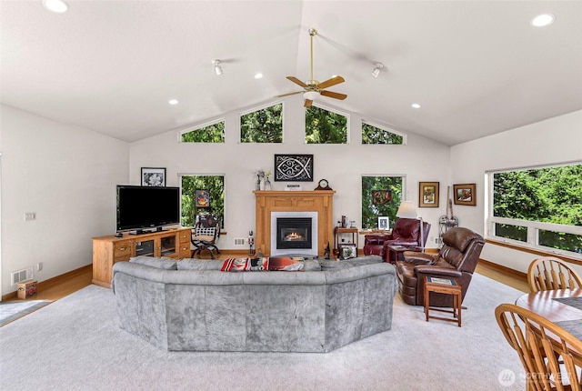 527 Fern Rd, Bellingham, WA 98225 - living room with a glass covered fireplace, lofted ceiling, a ceiling fan, recessed lighting, and light wood-style floors