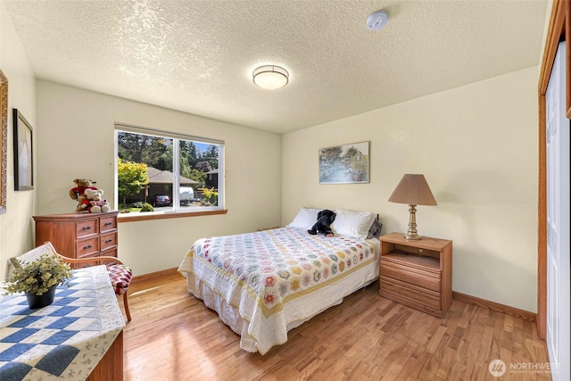 527 Fern Rd, Bellingham, WA 98225 - bedroom featuring light wood finished floors and a textured ceiling