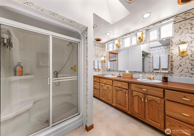 527 Fern Rd, Bellingham, WA 98225 - full bath featuring wallpapered walls, double vanity, a stall shower, a textured ceiling, and recessed lighting