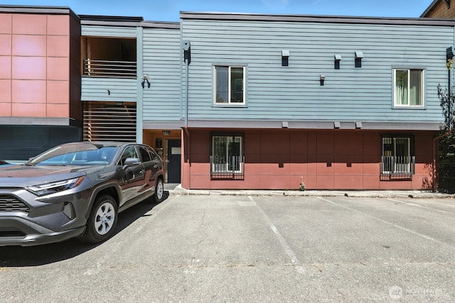29 Etruria St Unit B405, Seattle, WA 98109 - view of building exterior with uncovered parking