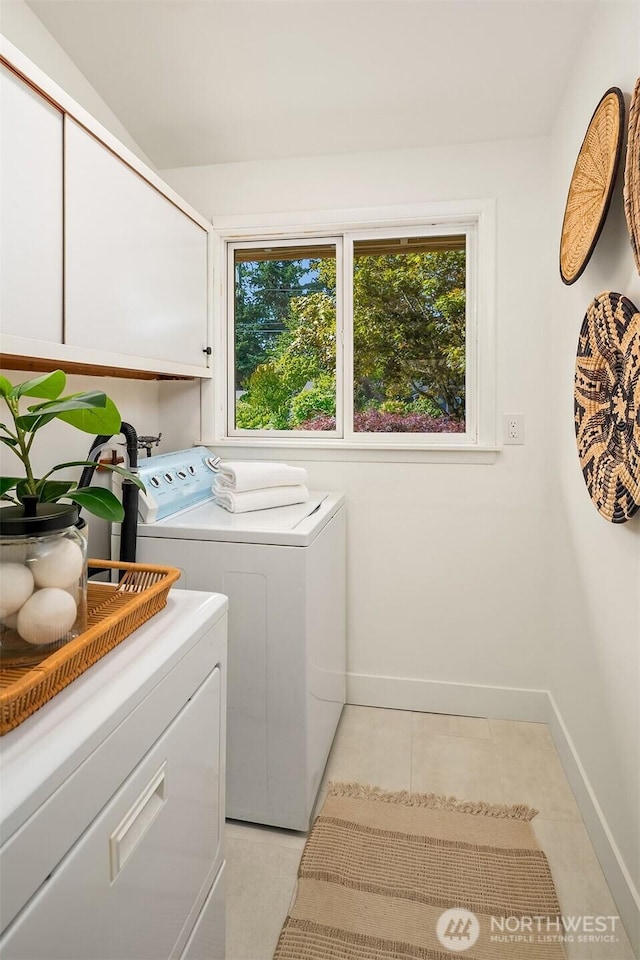 16223 NE 26th St, Bellevue, WA 98008 - laundry area with cabinet space, washer and clothes dryer, and light tile patterned flooring