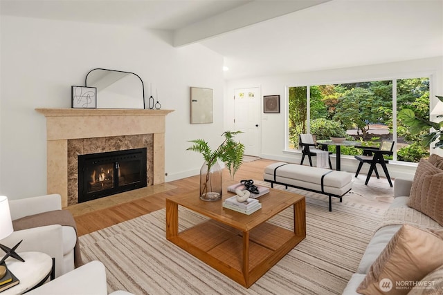 16223 NE 26th St, Bellevue, WA 98008 - living room with wood finished floors, beam ceiling, and a premium fireplace