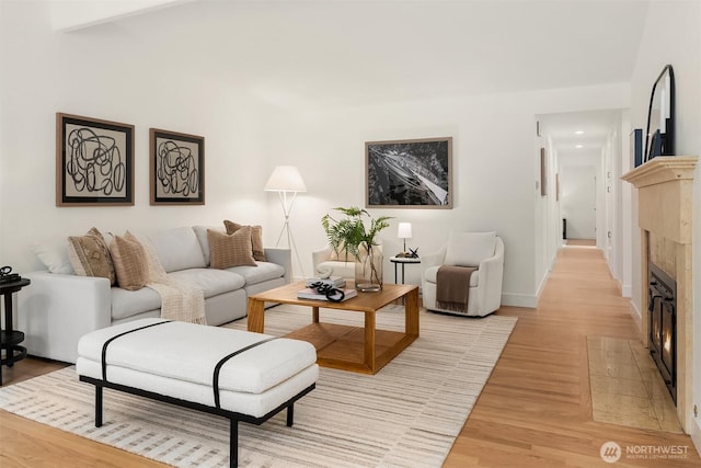 16223 NE 26th St, Bellevue, WA 98008 - living room featuring a tiled fireplace and light wood-style floors
