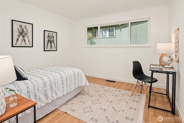 16223 NE 26th St, Bellevue, WA 98008 - bedroom featuring baseboards and wood finished floors
