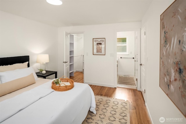 16223 NE 26th St, Bellevue, WA 98008 - bedroom featuring light wood finished floors and a spacious closet