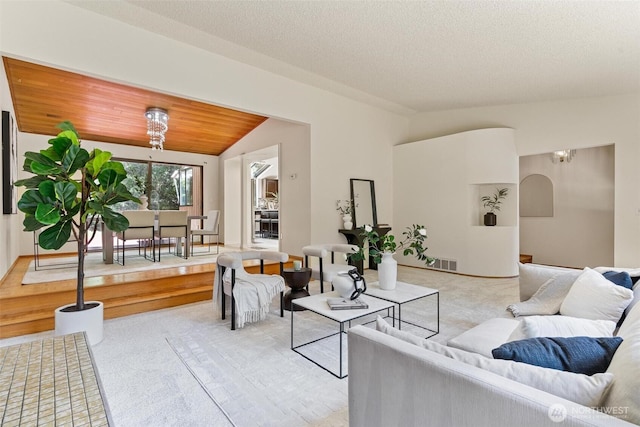 17726 NE 26th St, Redmond, WA 98052 - living room with lofted ceiling, light carpet, a chandelier, and arched walkways