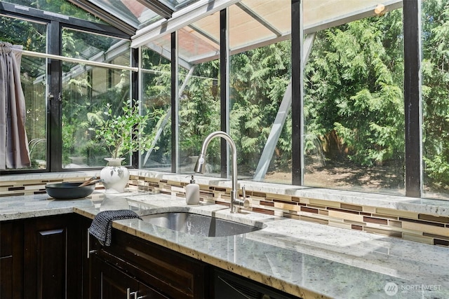 17726 NE 26th St, Redmond, WA 98052 - kitchen with a sunroom, tasteful backsplash, and light stone counters
