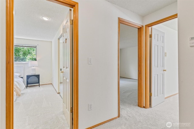 17726 NE 26th St, Redmond, WA 98052 - corridor with carpet flooring and a textured ceiling