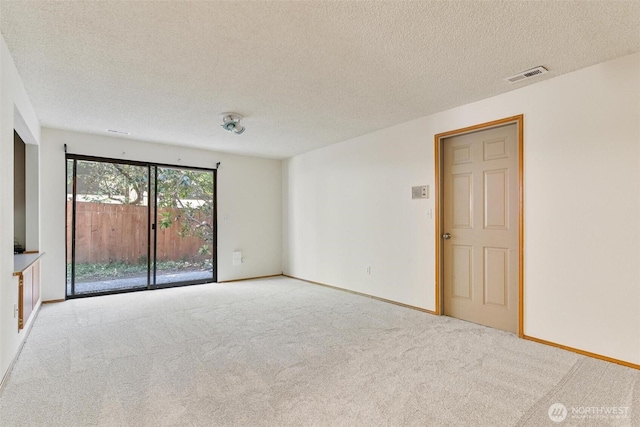17726 NE 26th St, Redmond, WA 98052 - carpeted empty room with a textured ceiling and baseboards