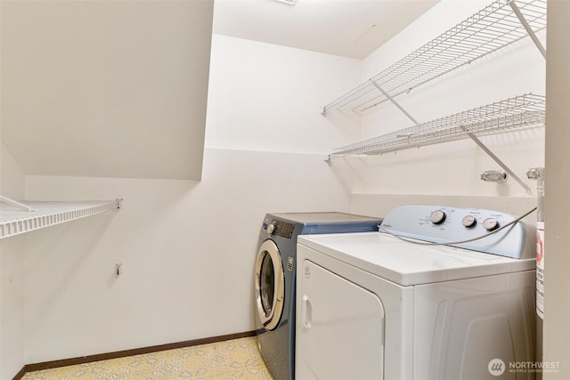 17726 NE 26th St, Redmond, WA 98052 - laundry area featuring independent washer and dryer and baseboards