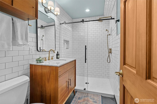10212 SW 127th St, Vashon, WA 98070 - full bathroom featuring vanity, a stall shower, tile patterned floors, tile walls, and recessed lighting