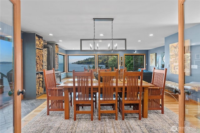 10212 SW 127th St, Vashon, WA 98070 - dining room with a chandelier, recessed lighting, and a wood stove