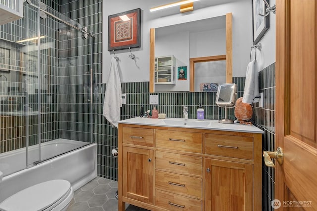 10212 SW 127th St, Vashon, WA 98070 - bathroom with tile walls, vanity, tile patterned floors, enclosed tub / shower combo, and wainscoting