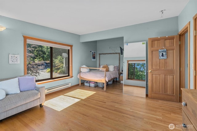 10212 SW 127th St, Vashon, WA 98070 - bedroom featuring a baseboard radiator and light wood-style floors