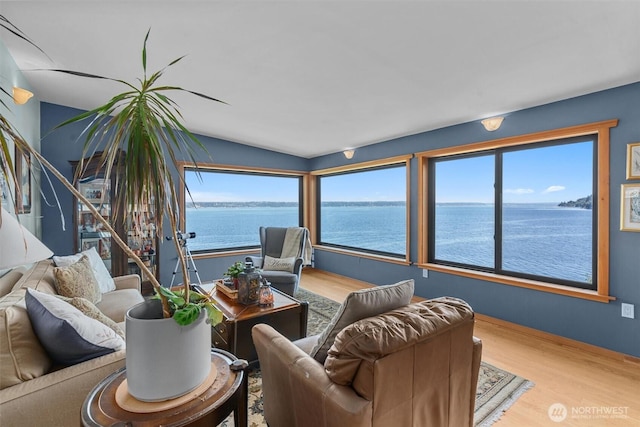 10212 SW 127th St, Vashon, WA 98070 - living area featuring wood finished floors, a water view, and lofted ceiling