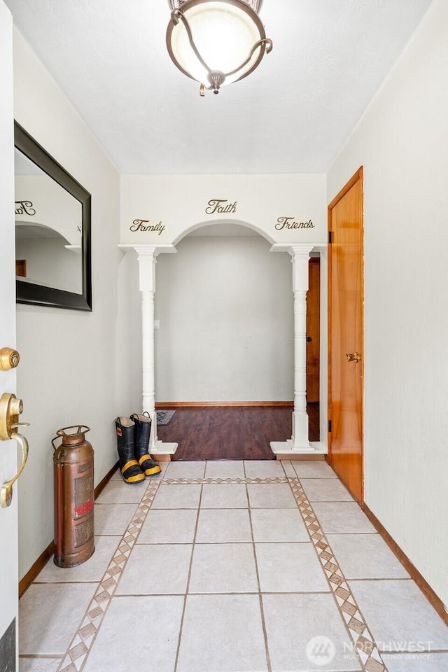 1315 Thomas St, Aberdeen, WA 98520 - hall with inlaid floor details, light tile patterned flooring, and decorative columns