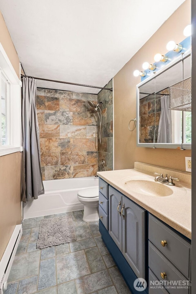 1315 Thomas St, Aberdeen, WA 98520 - full bathroom featuring a baseboard radiator, vanity, shower / bath combo with shower curtain, and stone finish floors