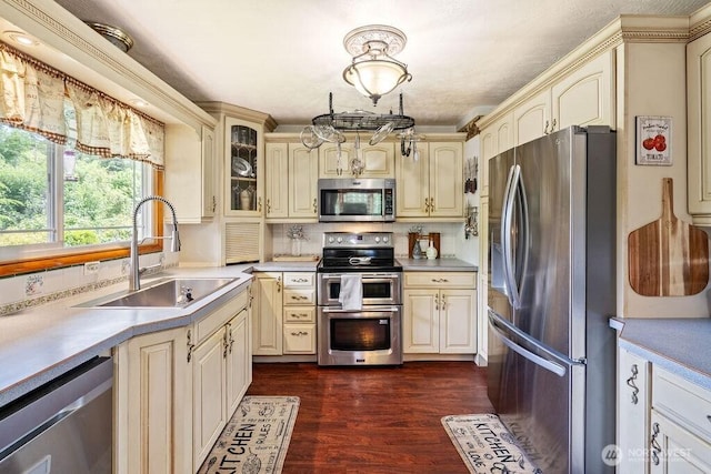 1315 Thomas St, Aberdeen, WA 98520 - kitchen with stainless steel appliances, cream cabinets, and light countertops