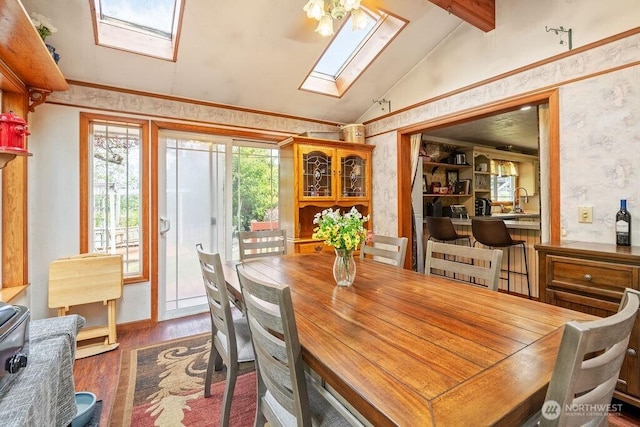 1315 Thomas St, Aberdeen, WA 98520 - dining room with a skylight, wood finished floors, and wallpapered walls