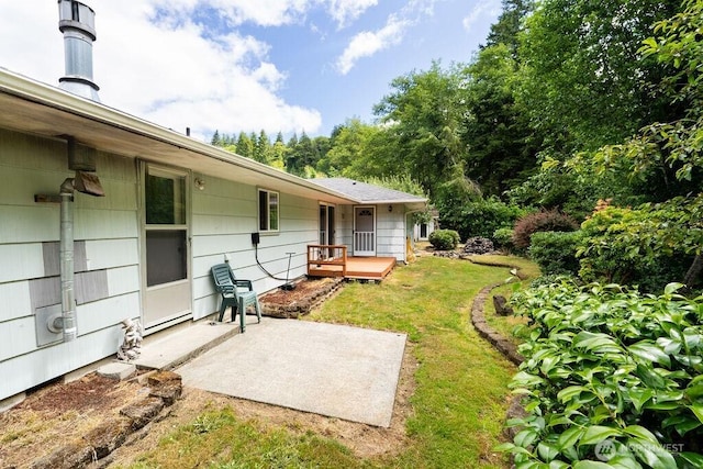 1315 Thomas St, Aberdeen, WA 98520 - view of green lawn with a patio area and a wooden deck