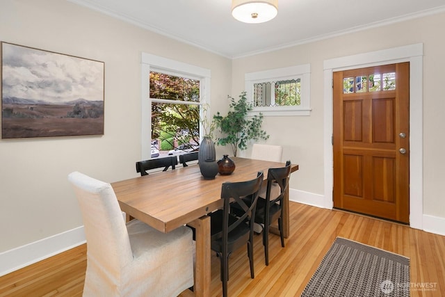 5041 Baker Ave NW, Seattle, WA 98107 - dining room featuring ornamental molding and light wood-style flooring