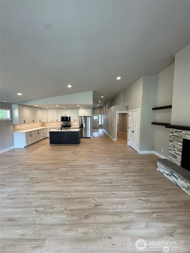 404 Trail St, Darrington, WA 98241 - unfurnished living room featuring light wood-type flooring, recessed lighting, and a fireplace
